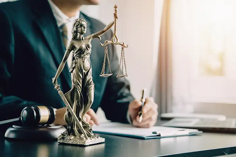 an image of a Texas Mesothelioma Attorney writing a document