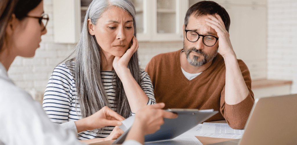 Family meeting with lawyer to discuss asbestos death compensation claim.